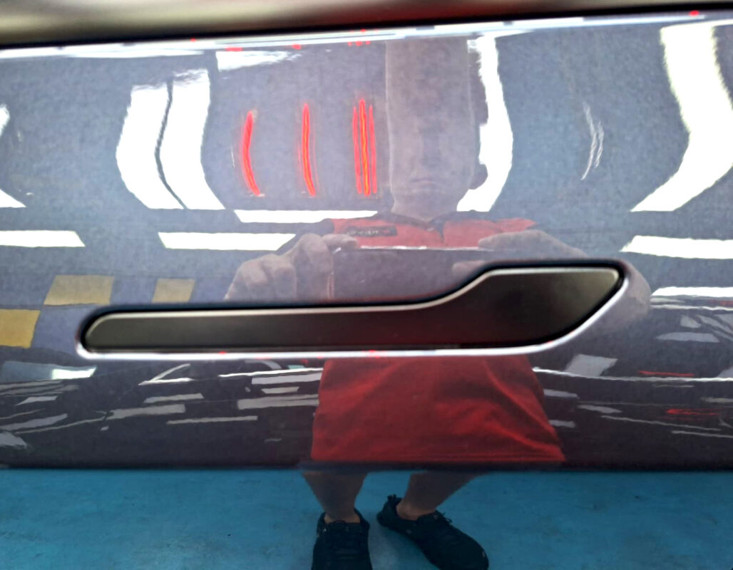 The coated paintwork of the Tesla Model 3, clean and sharp.