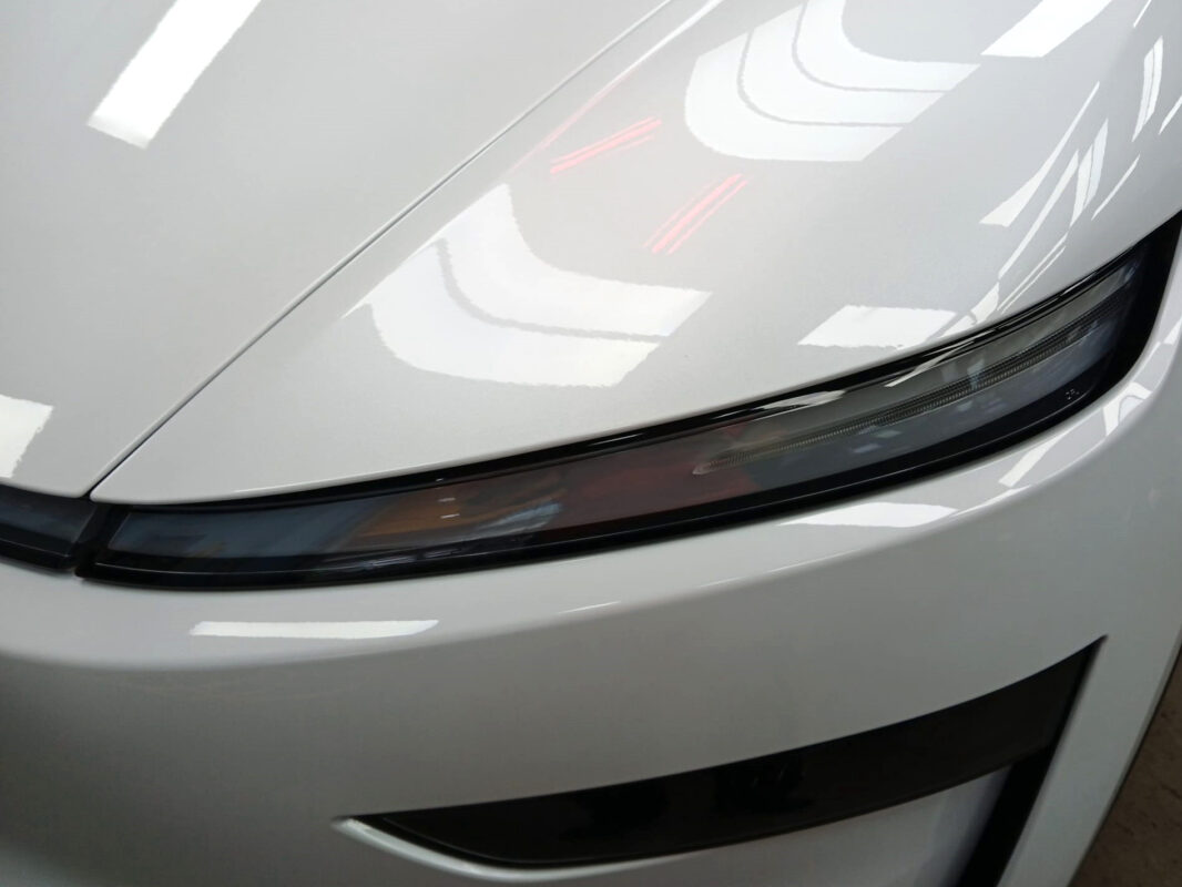 The Model Y's coated paintwork showing clean reflections.