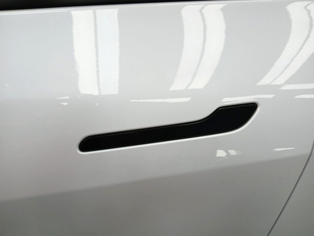 Front three-quarter view of the Tesla Model Y after coating.