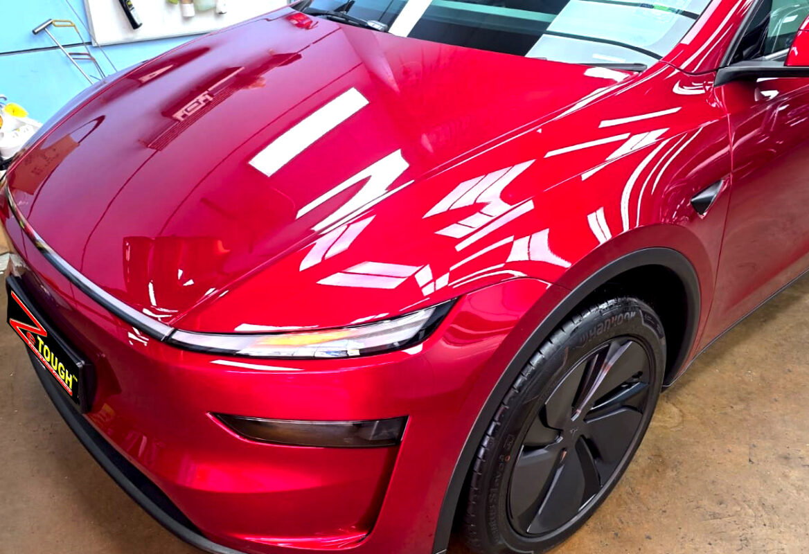 The Tesla Model Y from a side angle after the titanium coating.