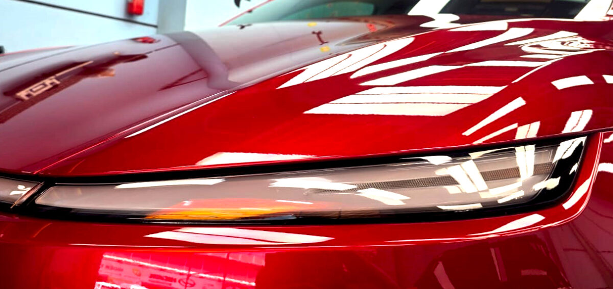 The Model Y's coated paintwork showing clean reflections.