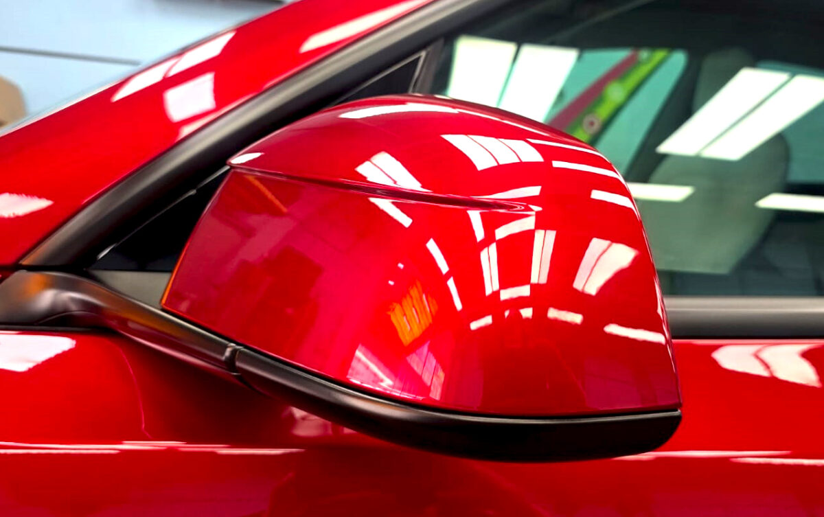 Side panel of the Tesla Model Y with the titanium finish locked in.