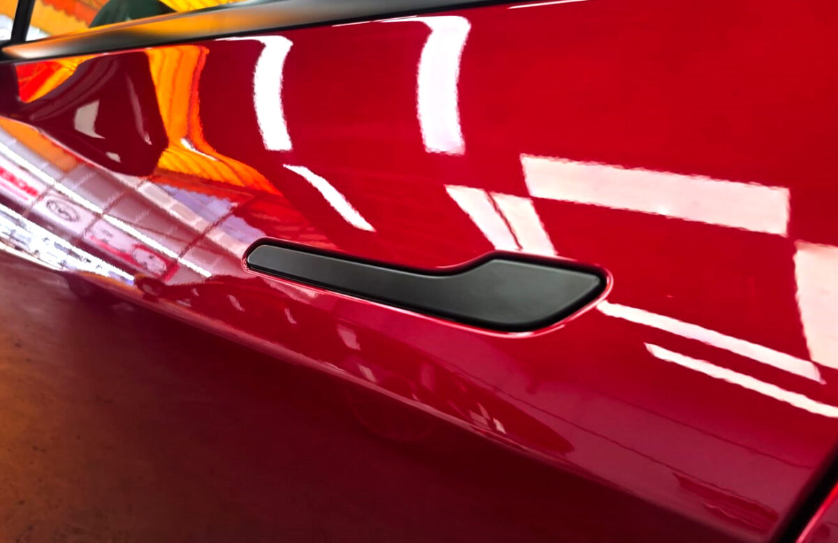 Front three-quarter view of the Tesla Model Y after coating.