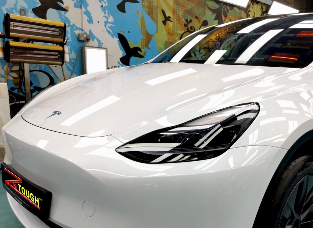 The Tesla Model Y from a side angle after the titanium coating.