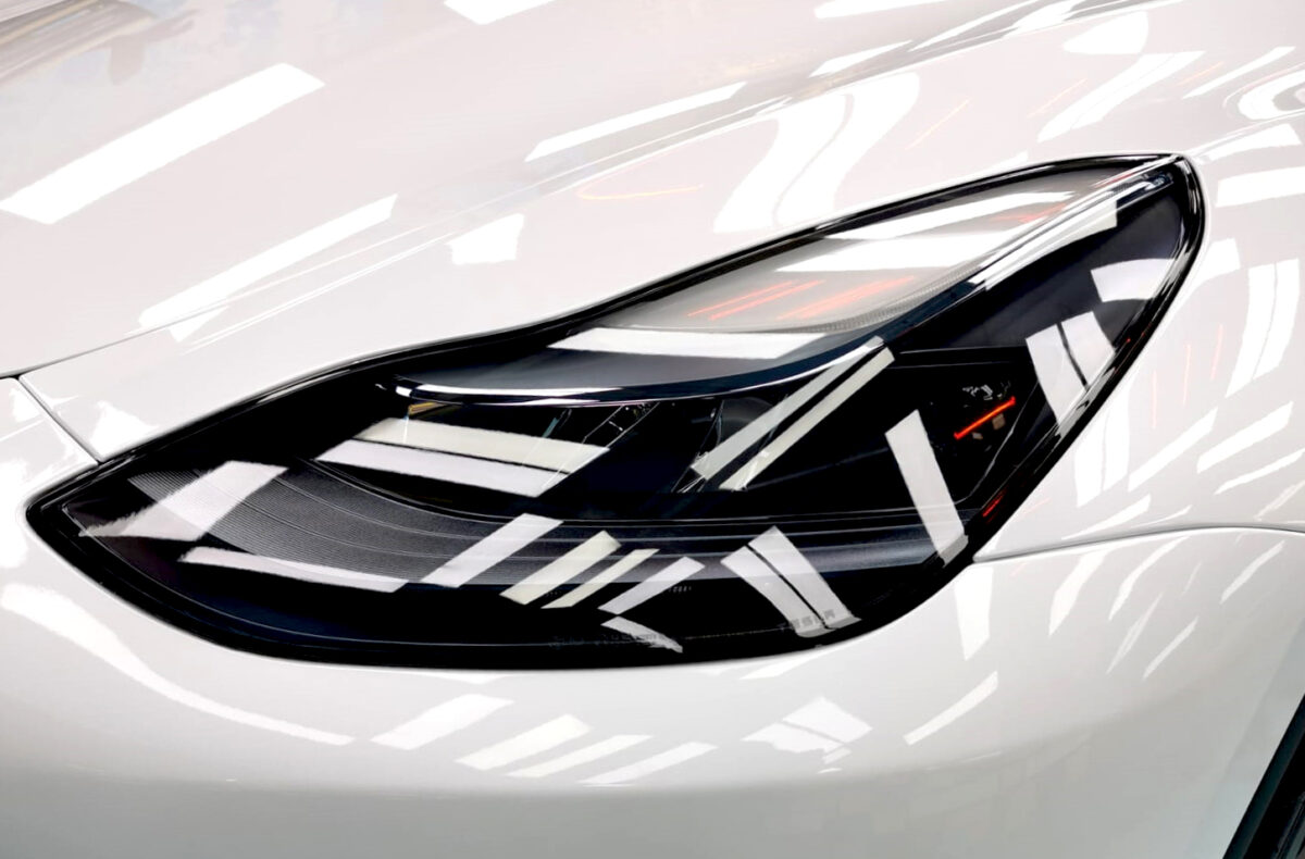 The Model Y's coated paintwork showing clean reflections.