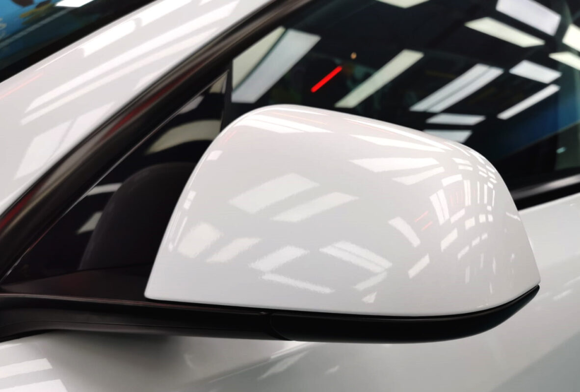 Side panel of the Tesla Model Y with the titanium finish locked in.