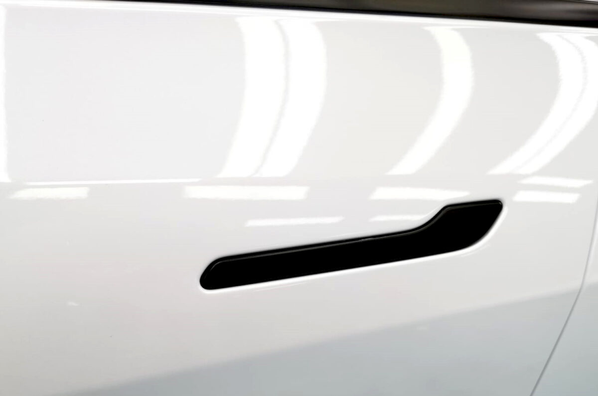 Front three-quarter view of the Tesla Model Y after coating.