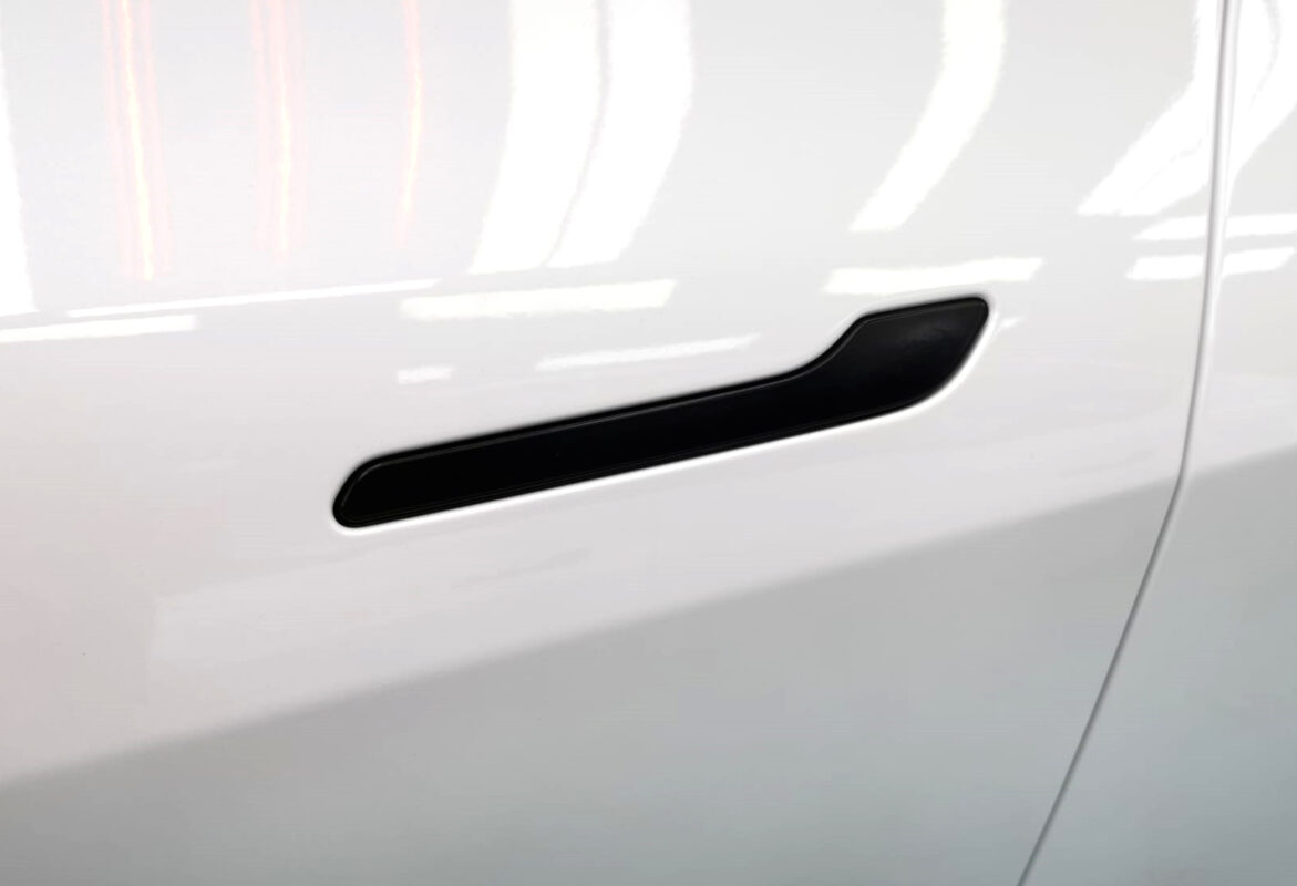 The coated paintwork of the Tesla Model Y, clean and sharp.