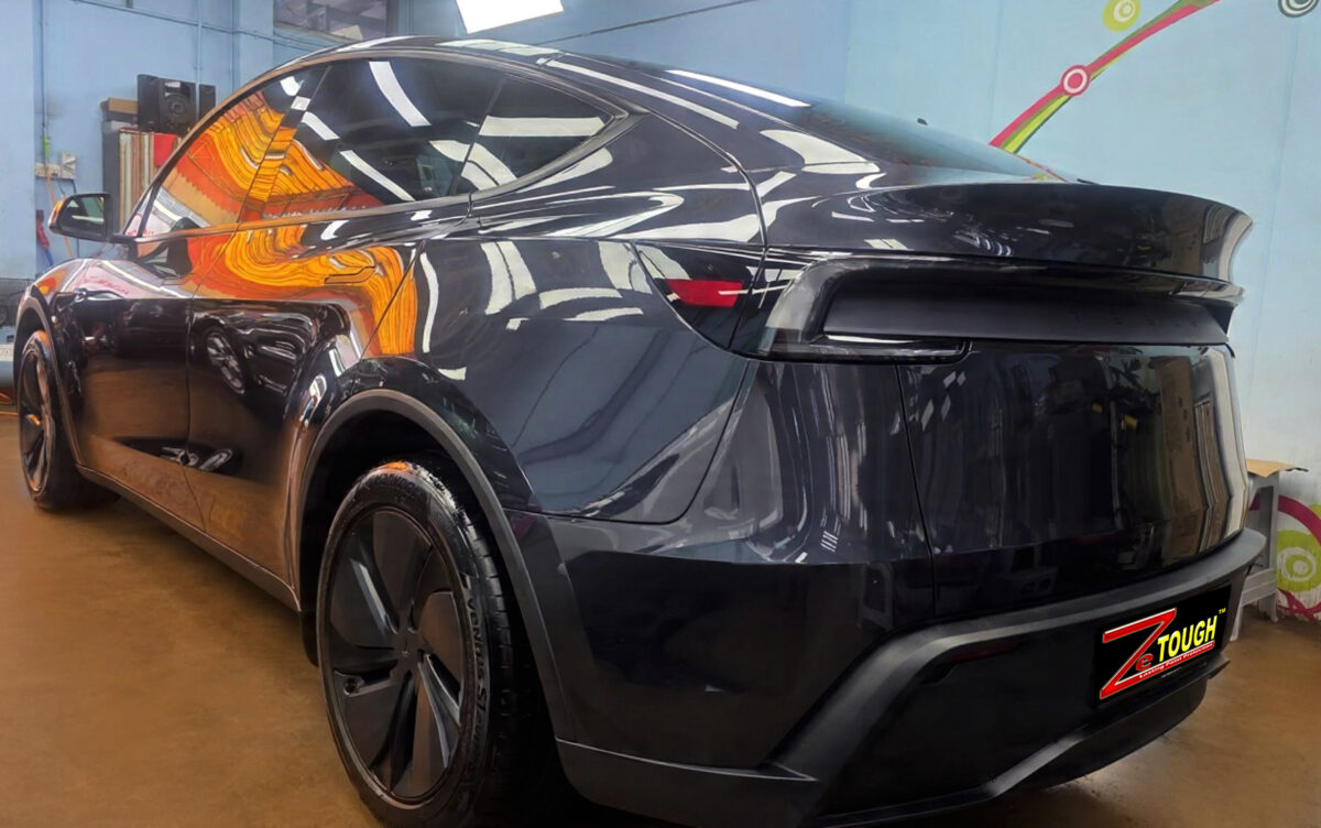 The coated paintwork of the Tesla Model Y, clean and sharp.