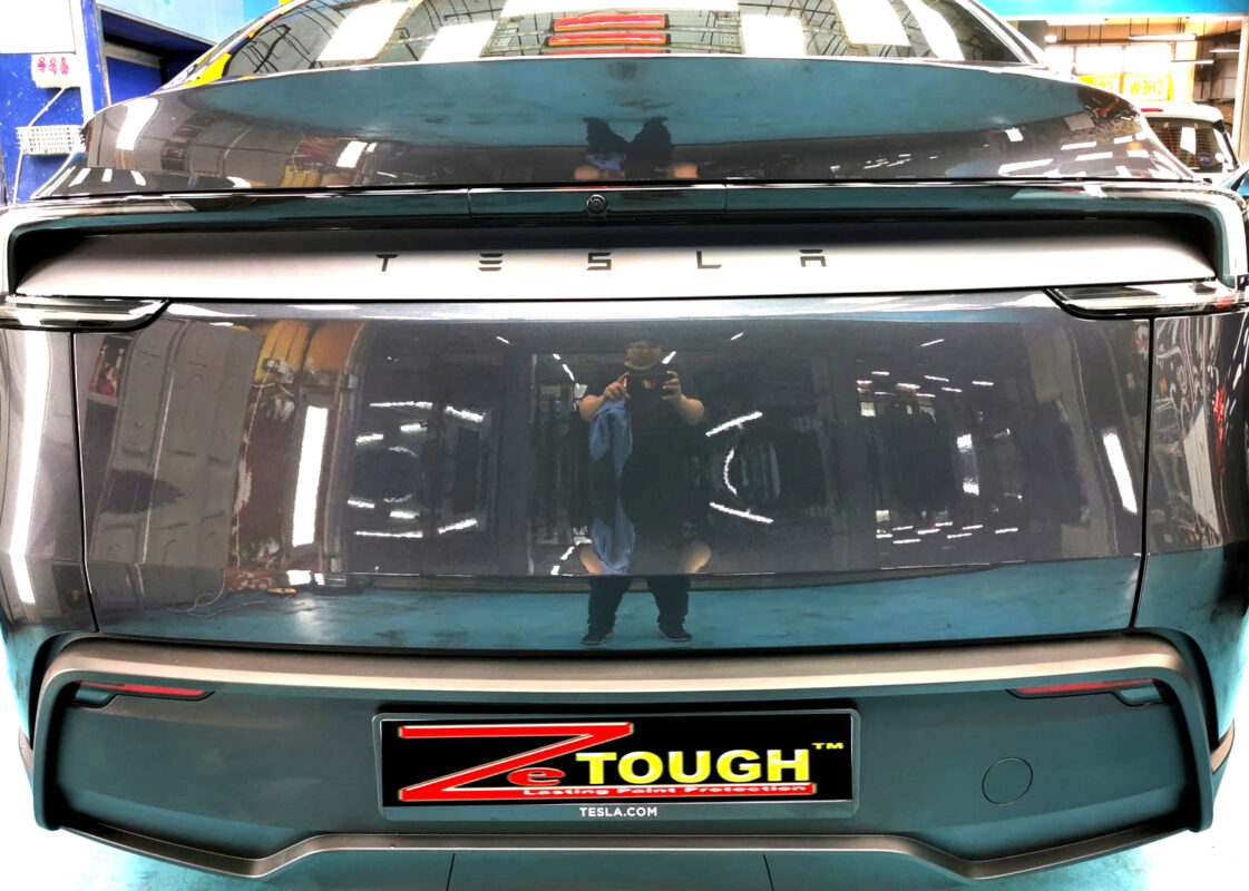 The finished Tesla Model Y, glossy and protected.