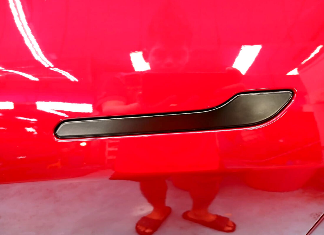 The coated paintwork of the Tesla Model Y, clean and sharp.