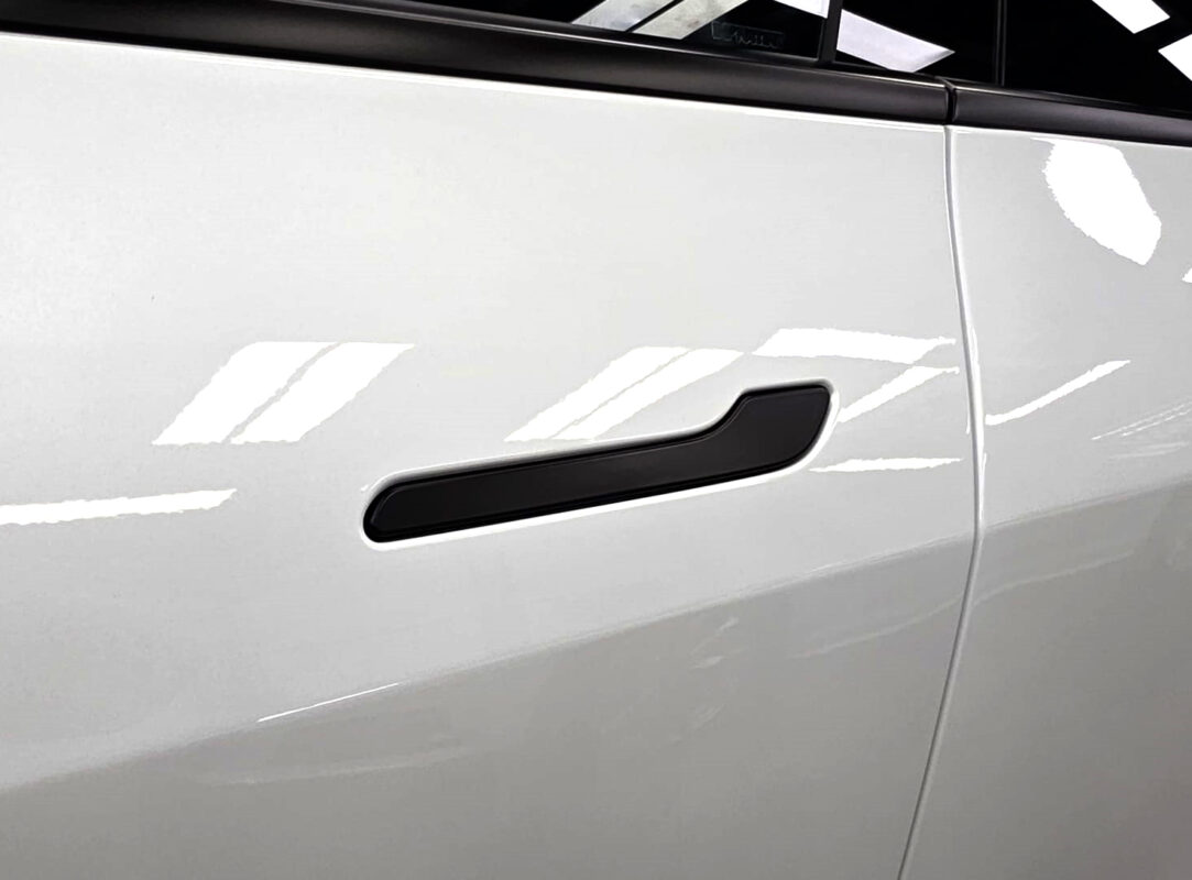 The coated paintwork of the Tesla Model Y, clean and sharp.