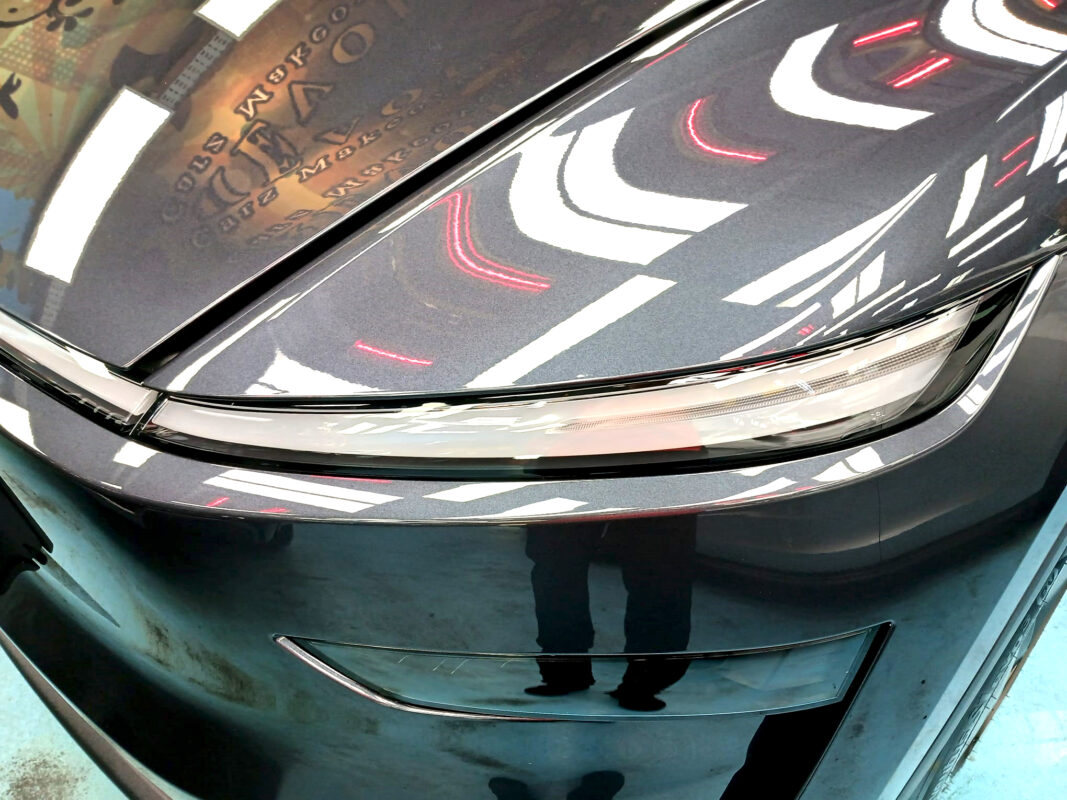 The Model Y's coated paintwork showing clean reflections.