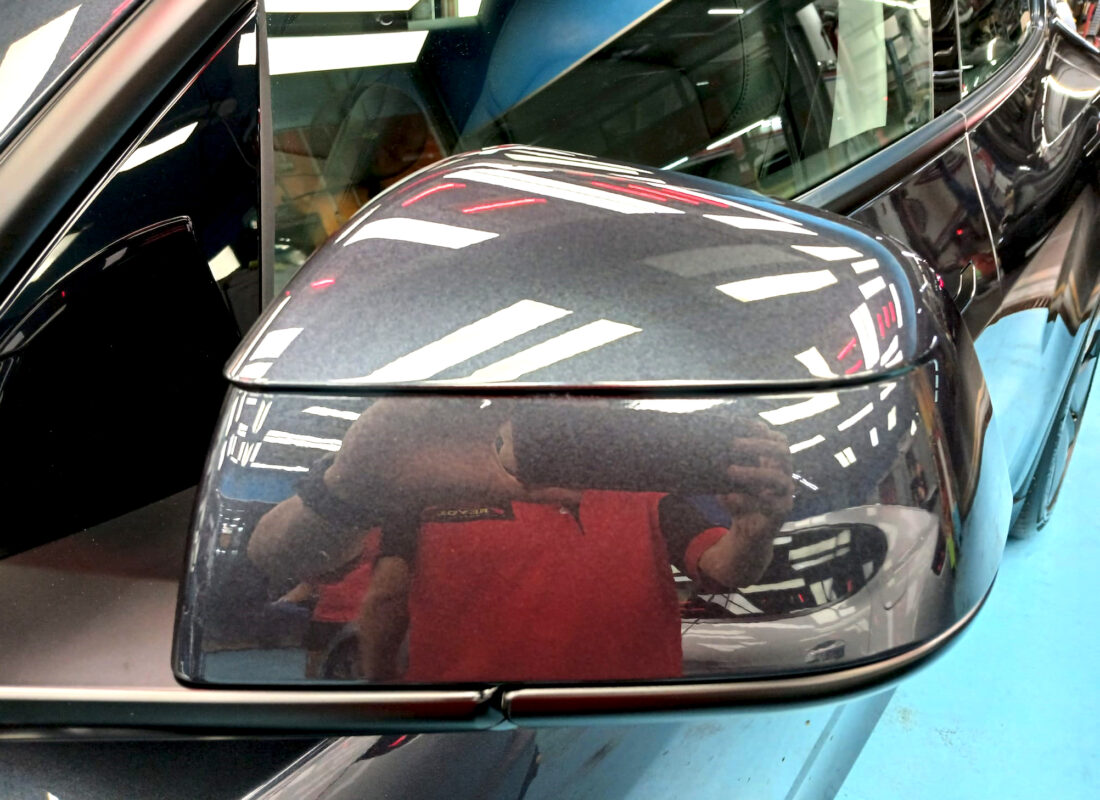 Side panel of the Tesla Model Y with the titanium finish locked in.