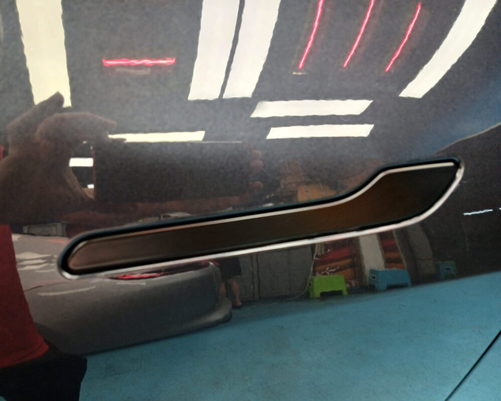 Front three-quarter view of the Tesla Model Y after coating.
