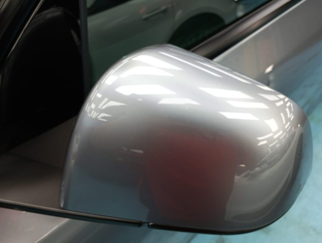 The Tesla Model Y parked in the workshop, freshly coated.