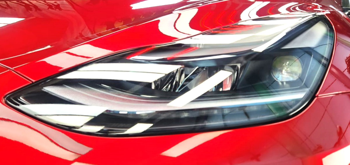 The Model Y's coated paintwork showing clean reflections.