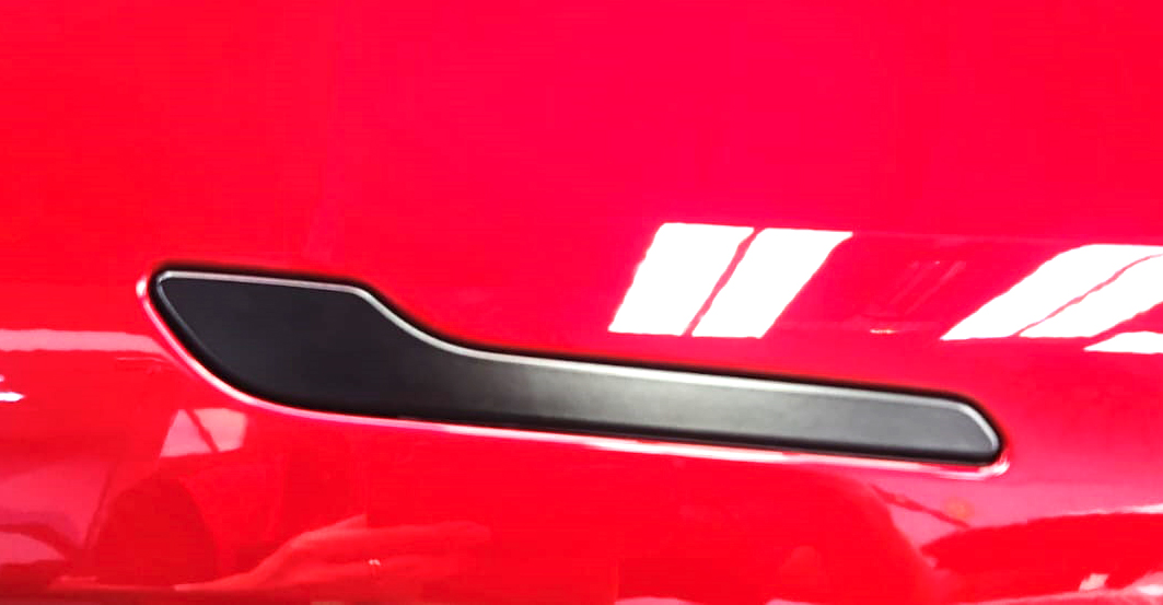 Front three-quarter view of the Tesla Model Y after coating.