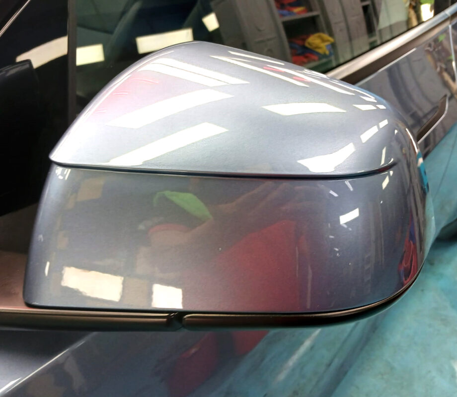 Side panel of the Tesla Model Y with the titanium finish locked in.