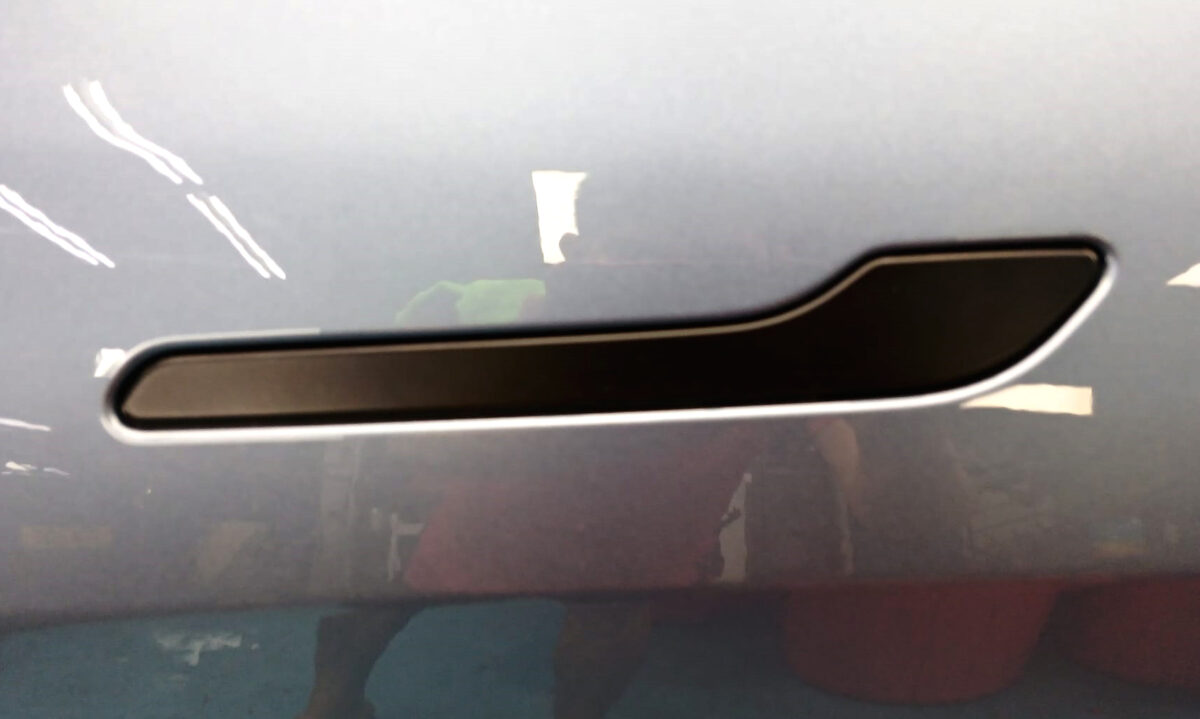 Front three-quarter view of the Tesla Model Y after coating.