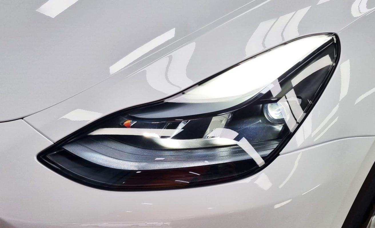 The Model Y's coated paintwork showing clean reflections.