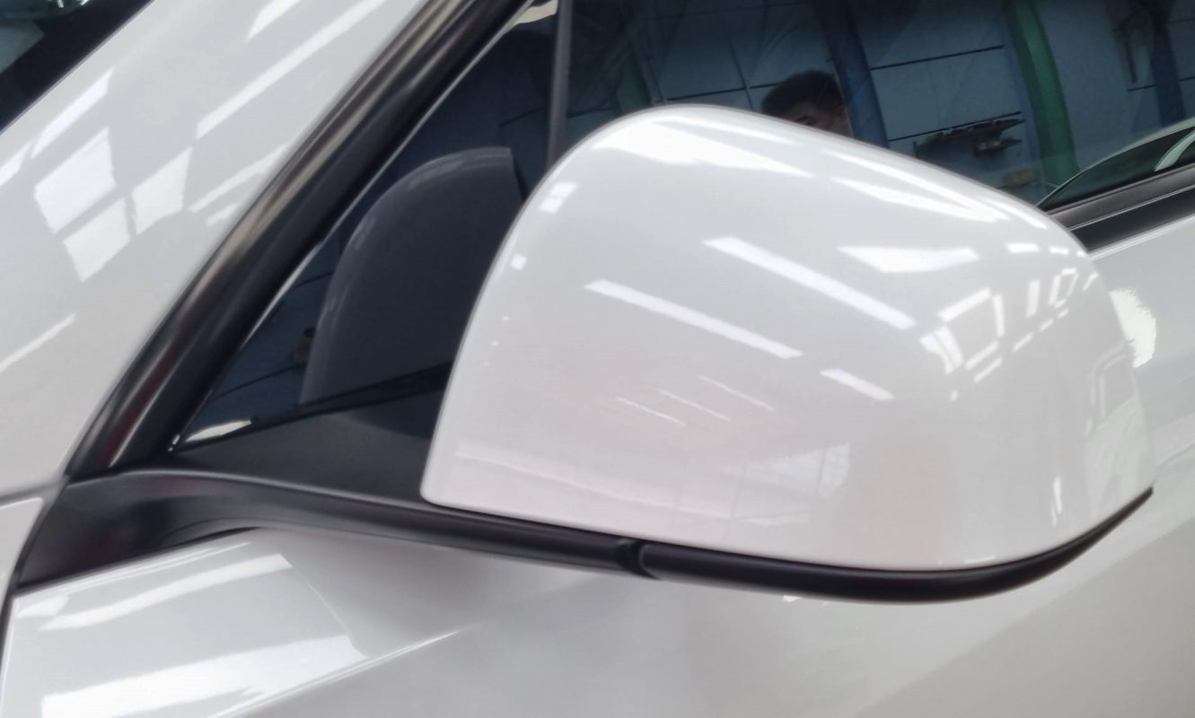 Side panel of the Tesla Model Y with the ceramic finish locked in.