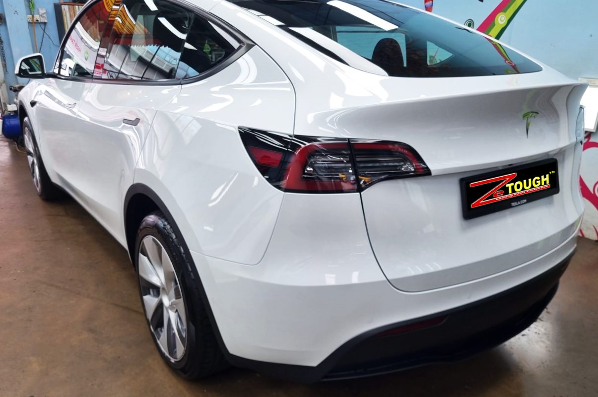 Front three-quarter view of the Tesla Model Y after coating.