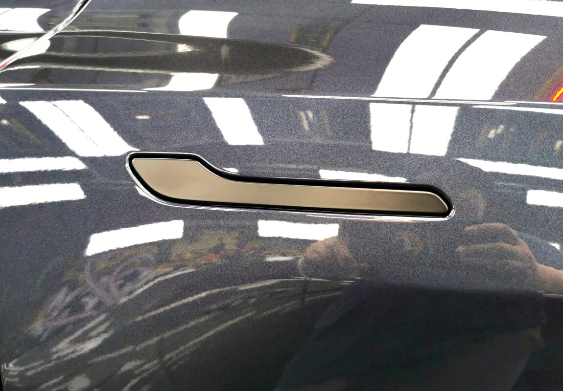 The coated paintwork of the Tesla Model Y, clean and sharp.