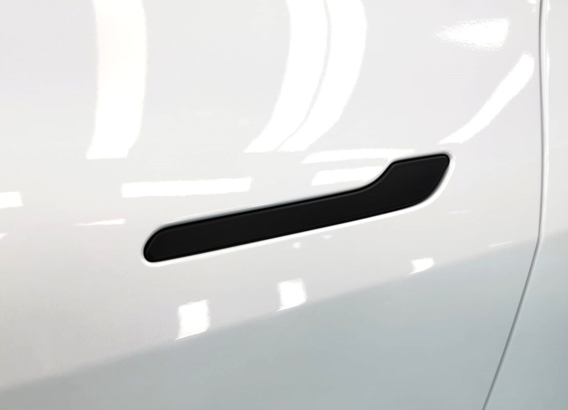 The coated paintwork of the Tesla Model Y, clean and sharp.