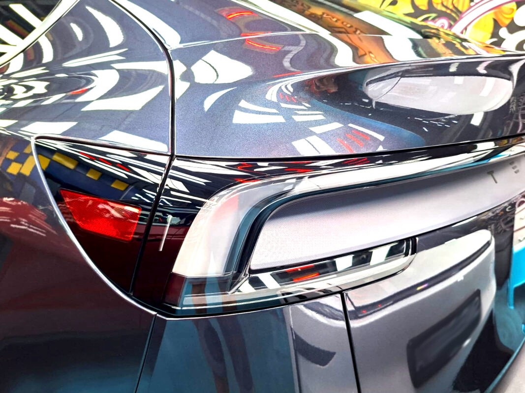 The coated paintwork of the Tesla Model Y, clean and sharp.