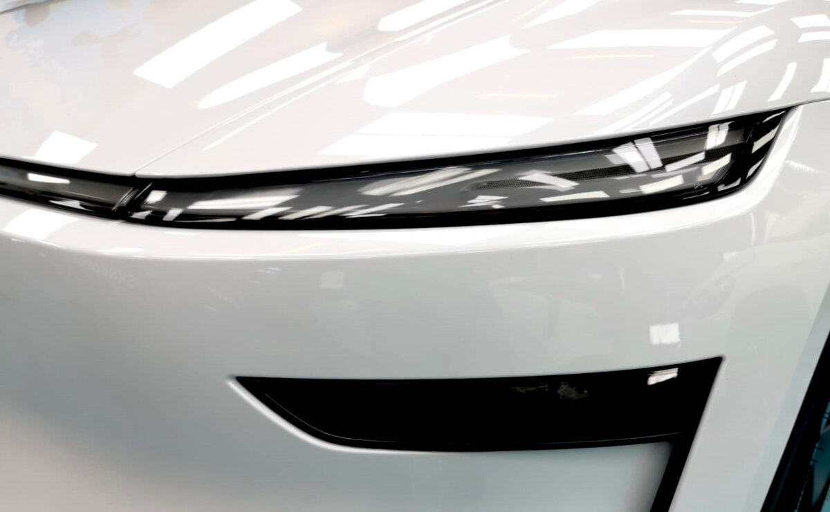 The Model Y's coated paintwork showing clean reflections.