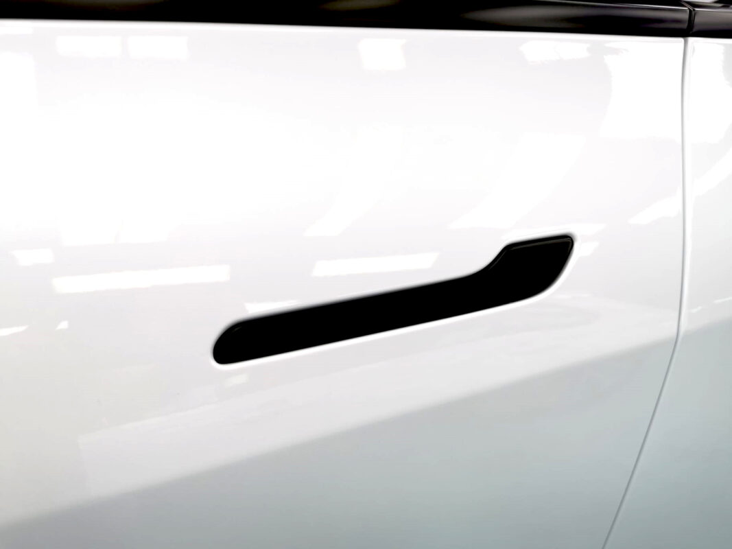 Front three-quarter view of the Tesla Model Y after coating.