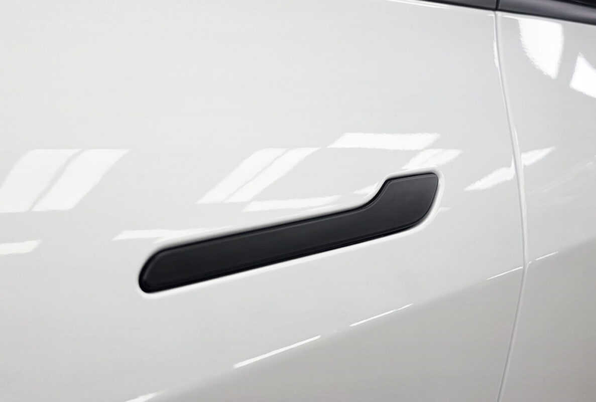 The coated paintwork of the Tesla Model Y, clean and sharp.