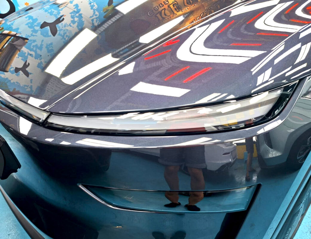 Glossy bodywork of the Tesla Model Y after coating.