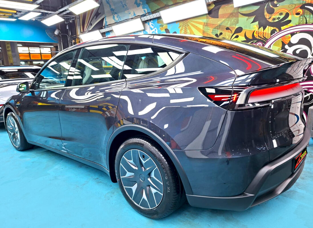 The coated paintwork of the Tesla Model Y, clean and sharp.