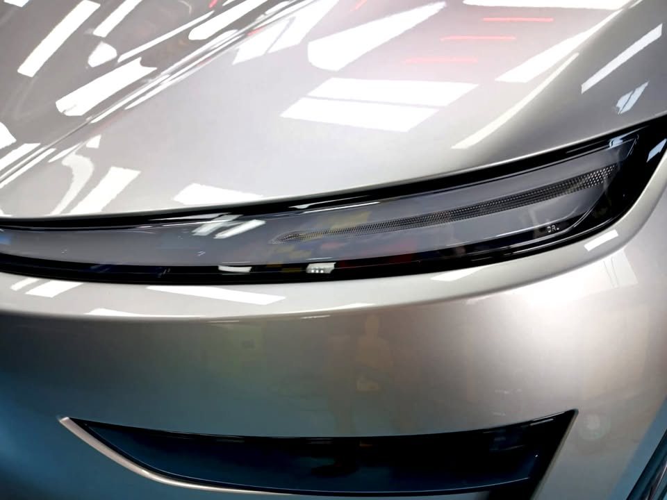 Close-up of the front light bar and lower bumper on the silver nose.