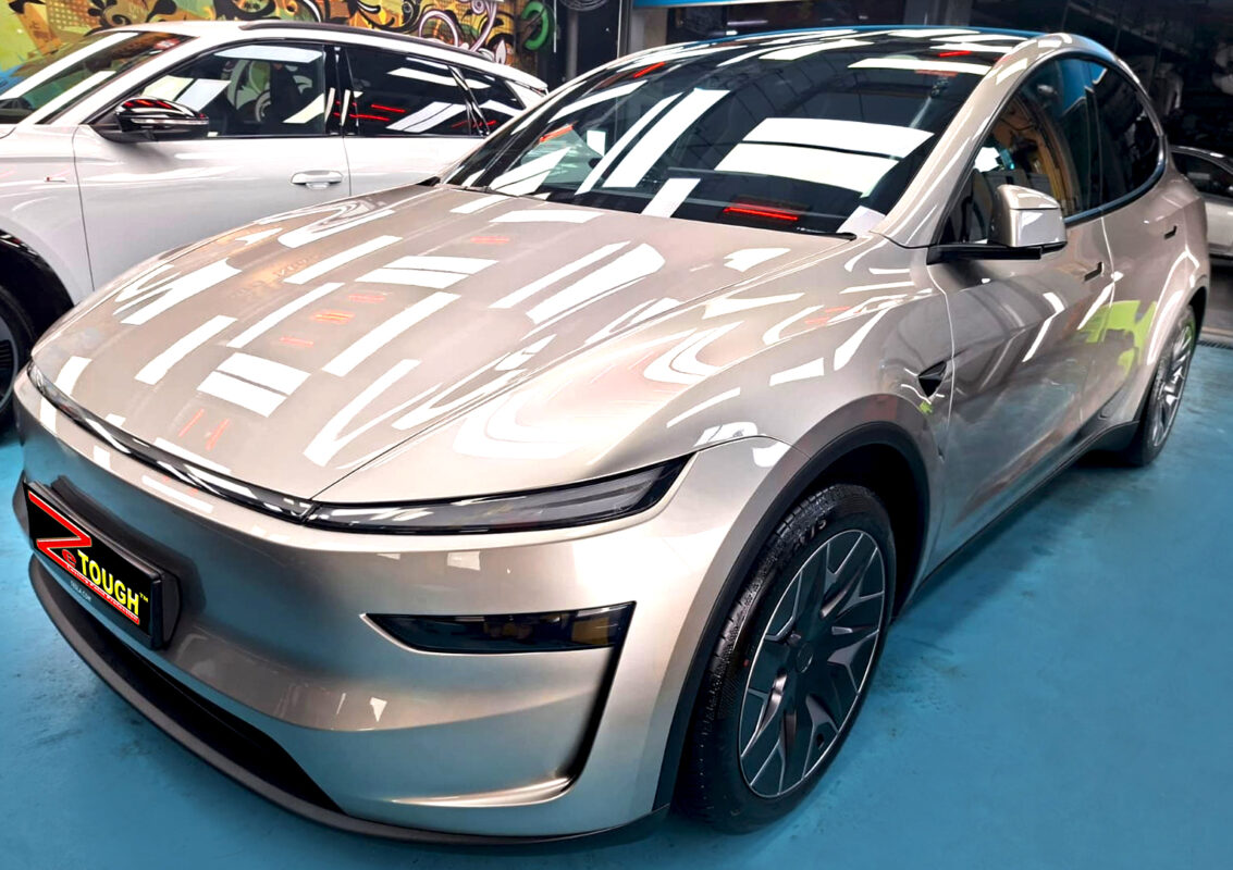 Champagne Tesla Model YL, glossy after its full detail and ZeTough Titanium coating.