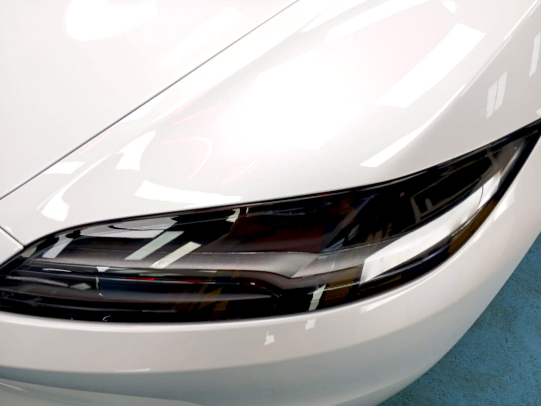The Model 3's coated paintwork showing clean reflections.