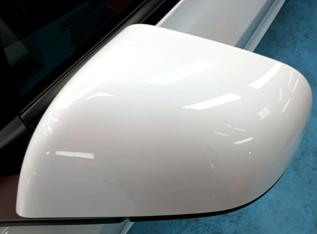 Side panel of the Tesla Model 3 with the titanium finish locked in.