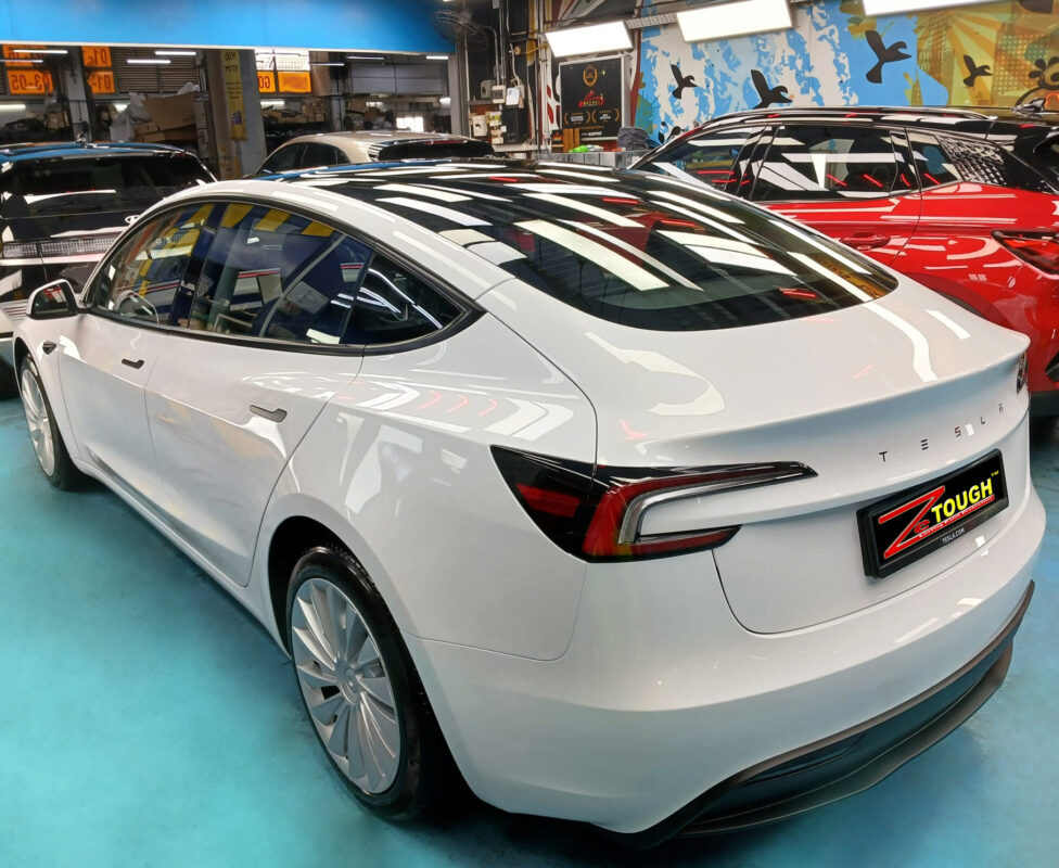 Front three-quarter view of the Tesla Model 3 after coating.