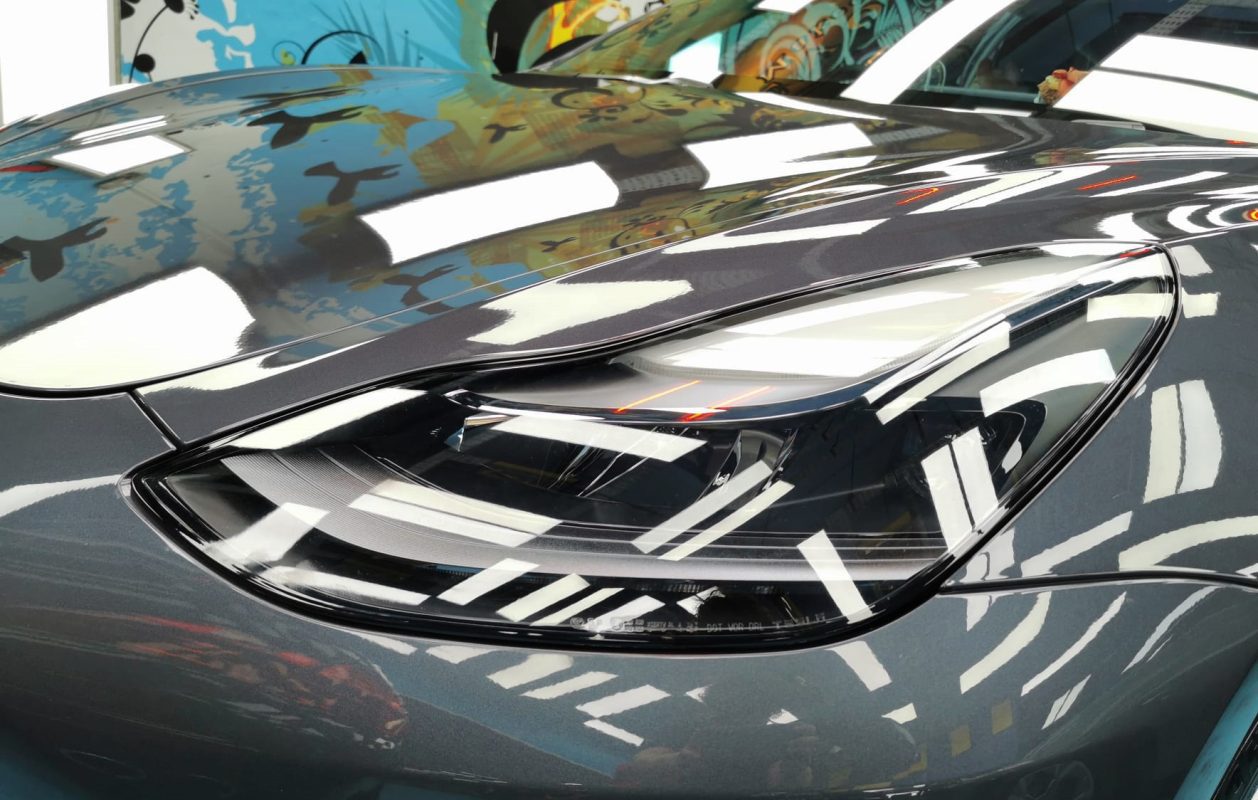 The Model 3's coated paintwork showing clean reflections.