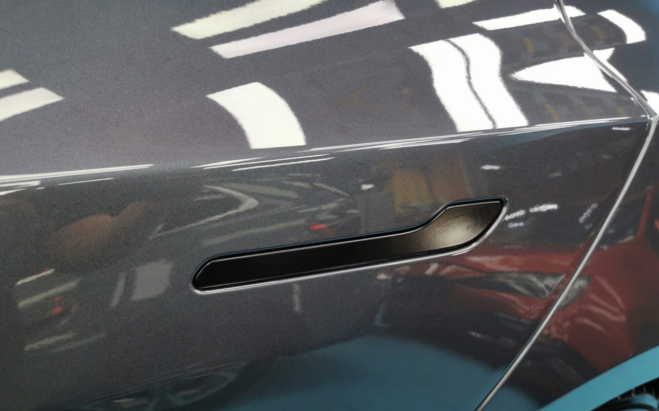 Side panel of the Tesla Model 3 with the ceramic finish locked in.