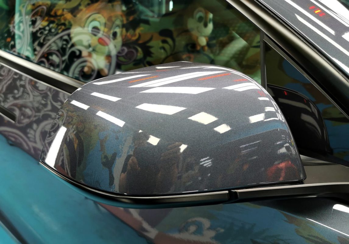 Front three-quarter view of the Tesla Model 3 after coating.
