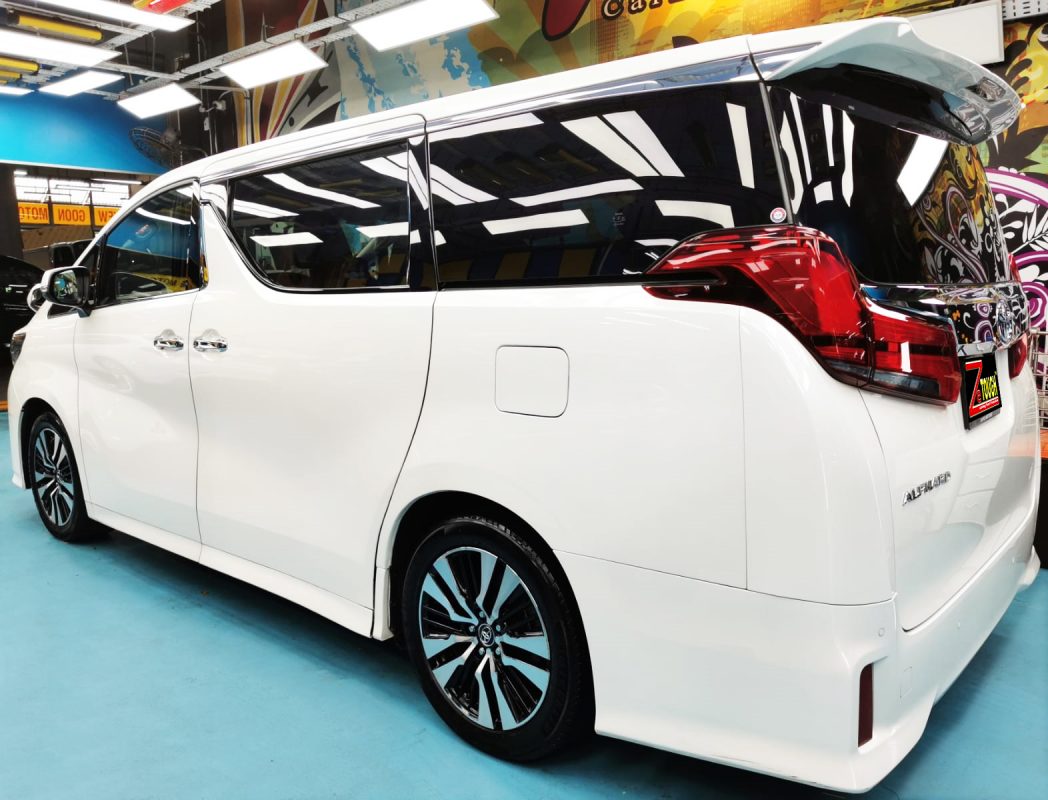 Rear quarter of the Toyota Alphard, glossy and protected.