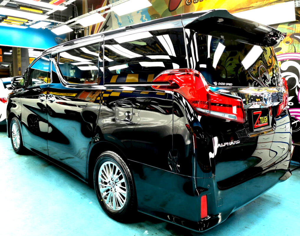 Rear quarter of the Toyota Alphard, glossy and protected.