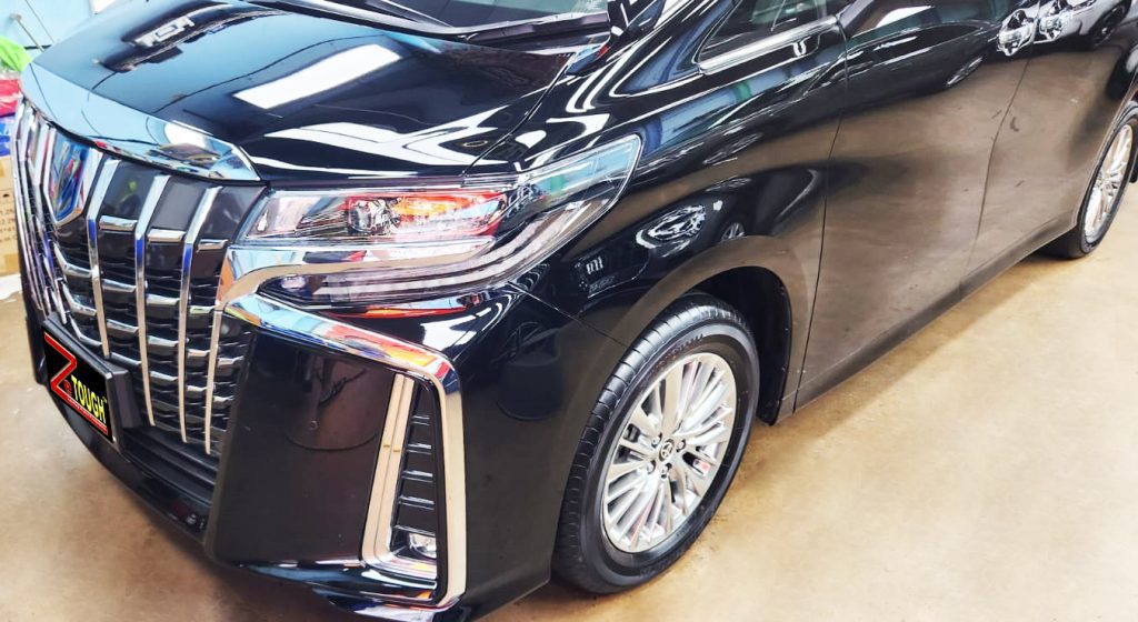 The Toyota Alphard from a side angle after the ceramic coating.