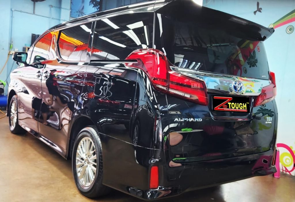 Rear quarter of the Toyota Alphard, glossy and protected.