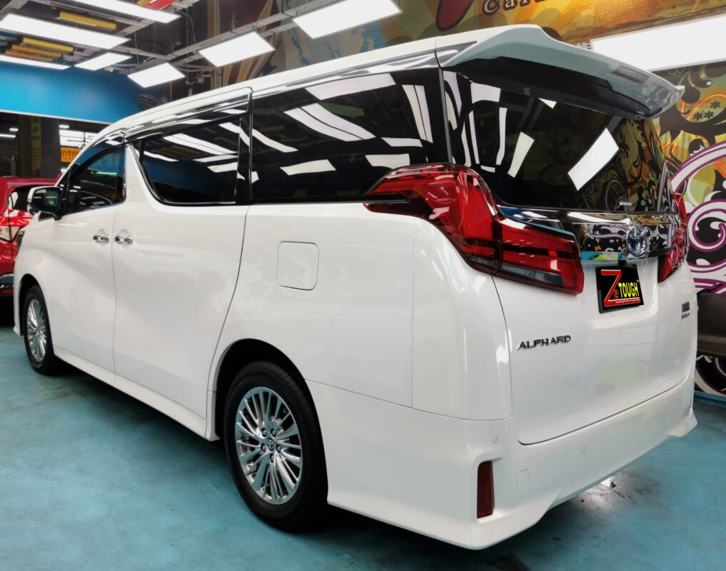 Rear quarter of the Toyota Alphard, glossy and protected.