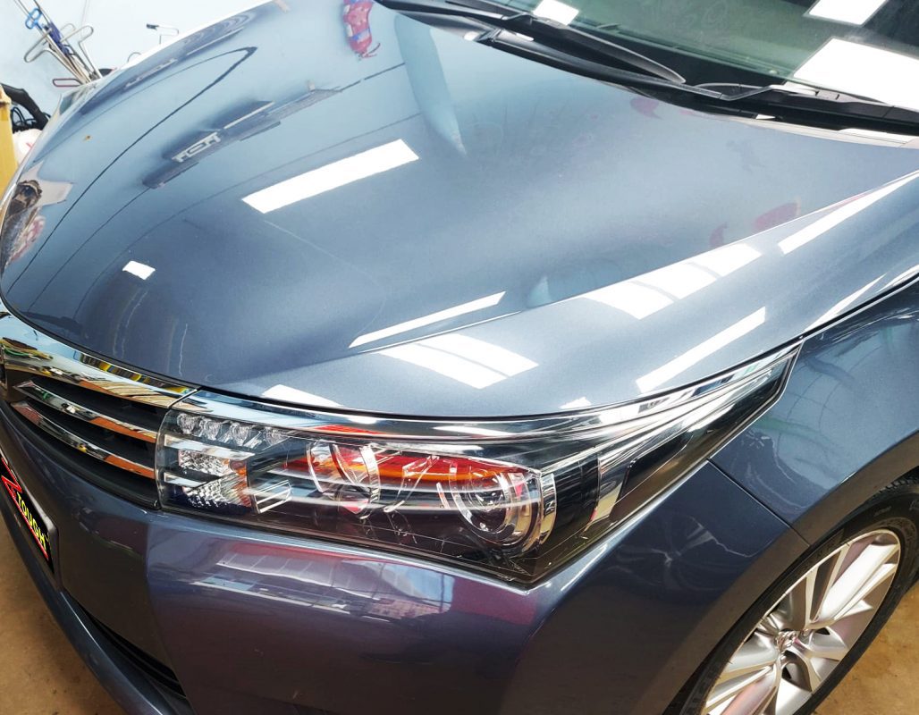 The Toyota Altis from a side angle after the ceramic coating.