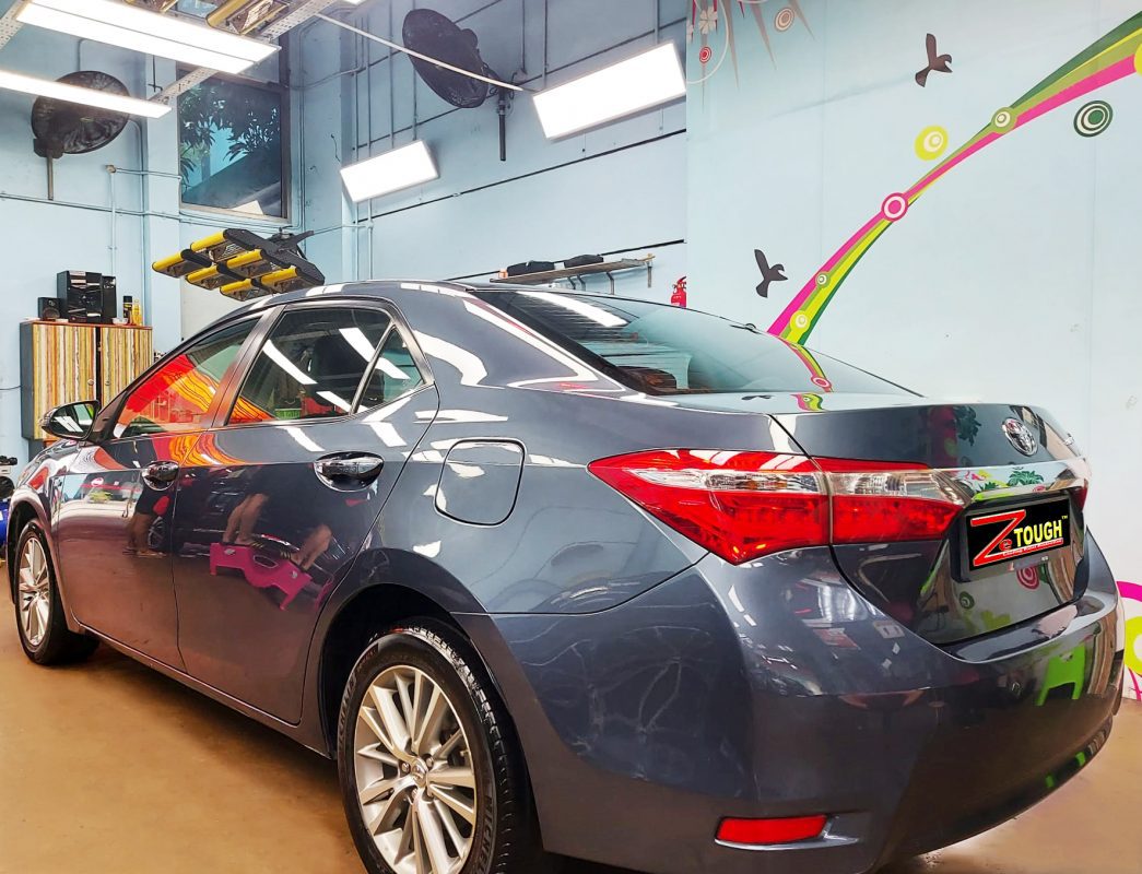 Rear quarter of the Altis, glossy and protected.